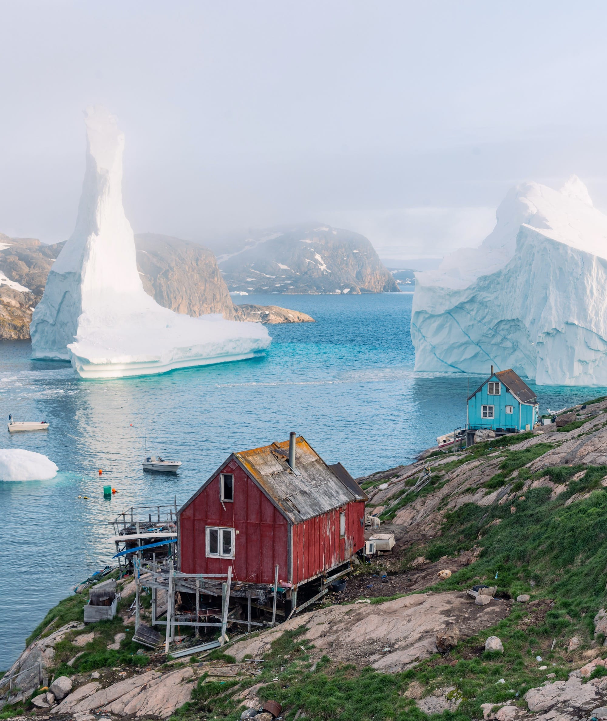 Dennis Lehtonen Documents a Pair of Immense Icebergs Paying a Visit to a Small Greenland Village — Colossal
