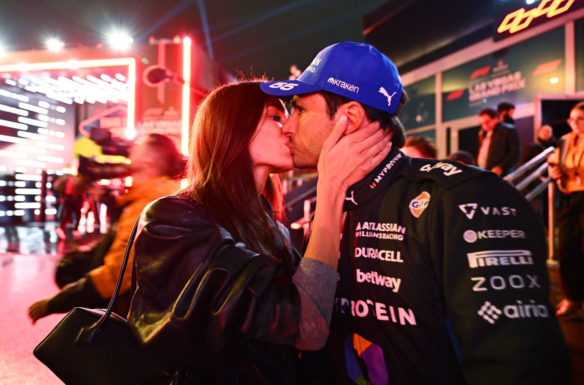 Rebecca Donaldson and Carlos Sainz share a moment as the Spaniard qualifies in the top 3 for the F1 Las Vegas GP