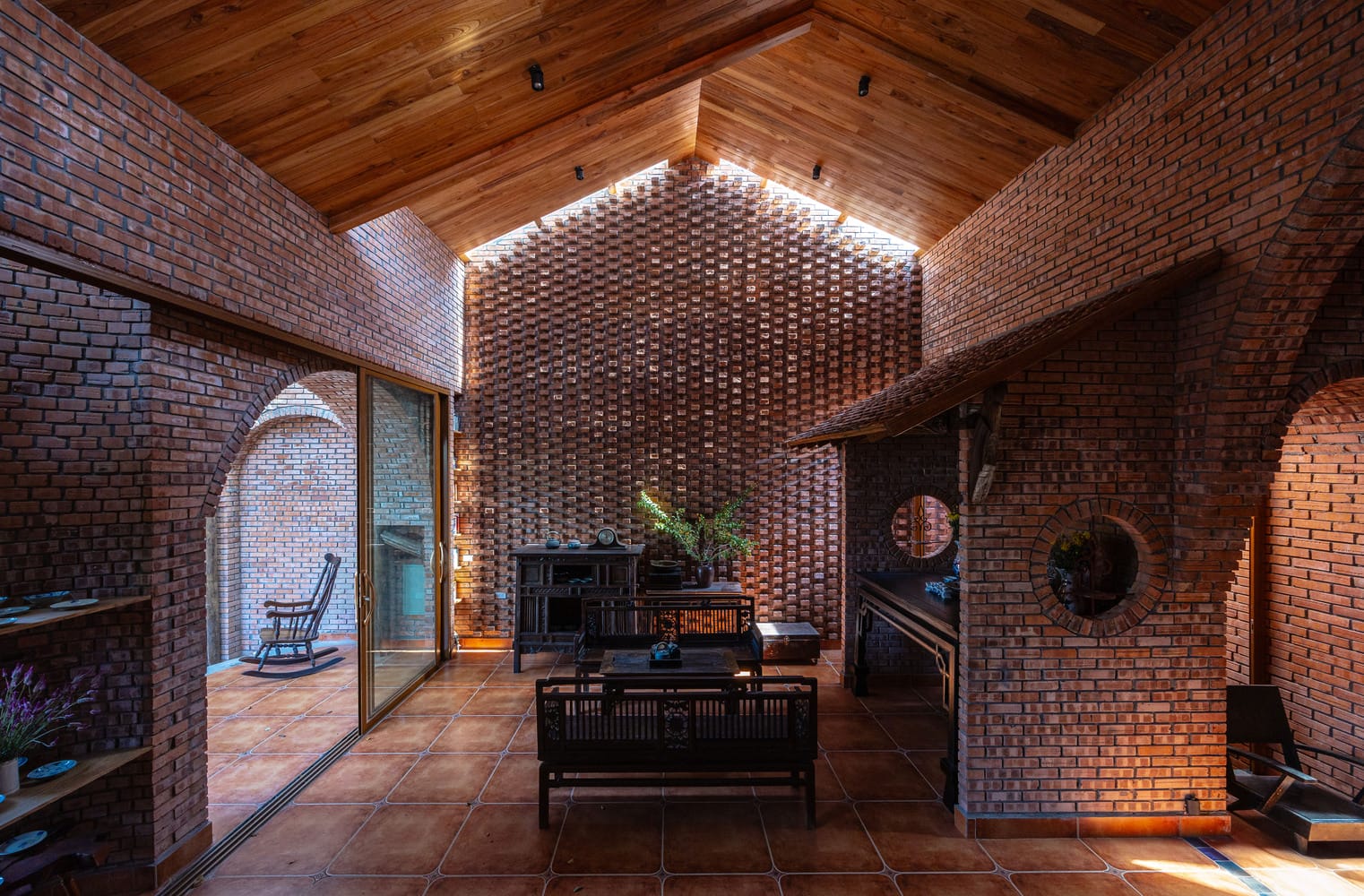 Trung Tran Studio Incorporates Mature Trees into a Warm Brick Home in Vietnam — Colossal